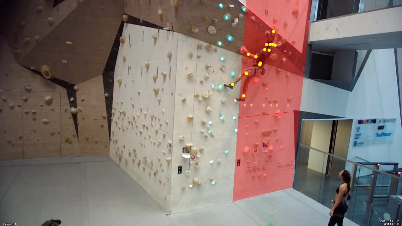 A climber climging on a climbing wall and going outside of his lane