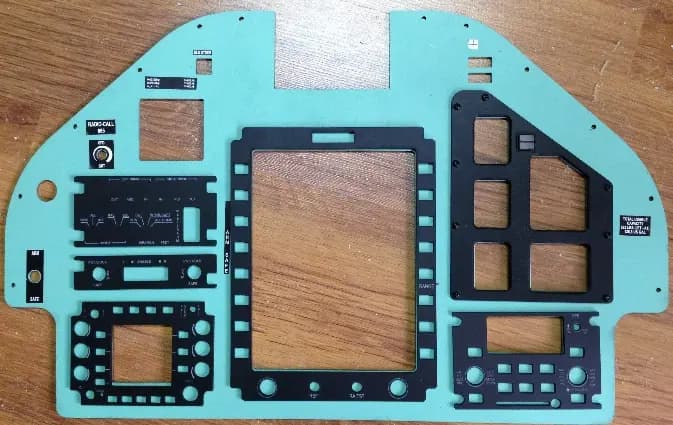 A monitor with a CNC cut main panel and buttons frames