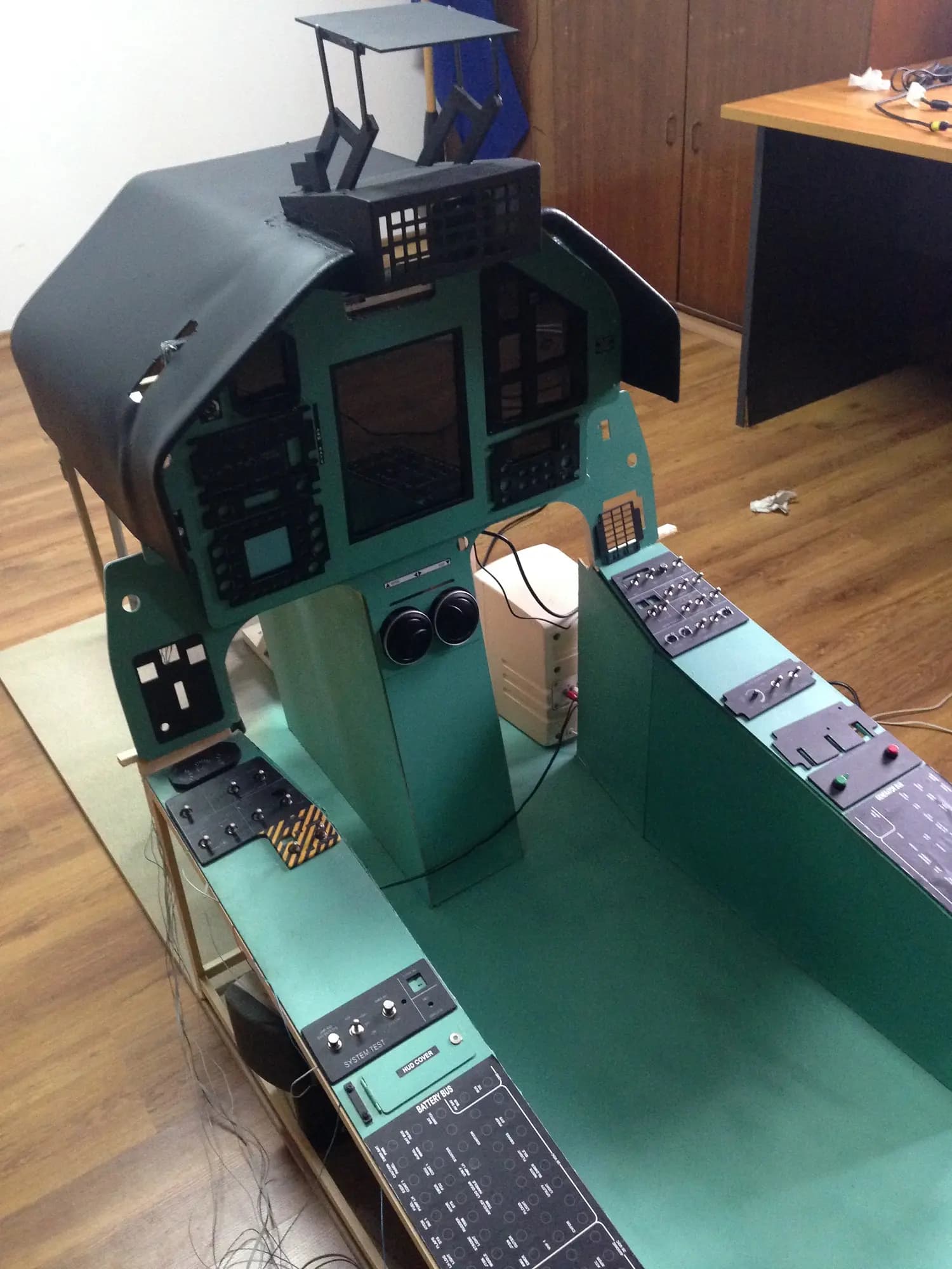Cockpit with side panels and center console of the PC-9M simulator prototype