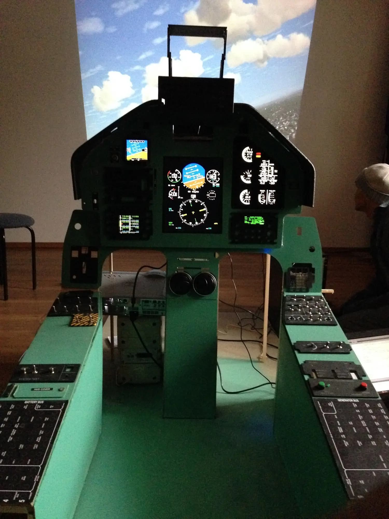A fully integrated and working cockpit with projected simulation for the PC-9m simulator prototype